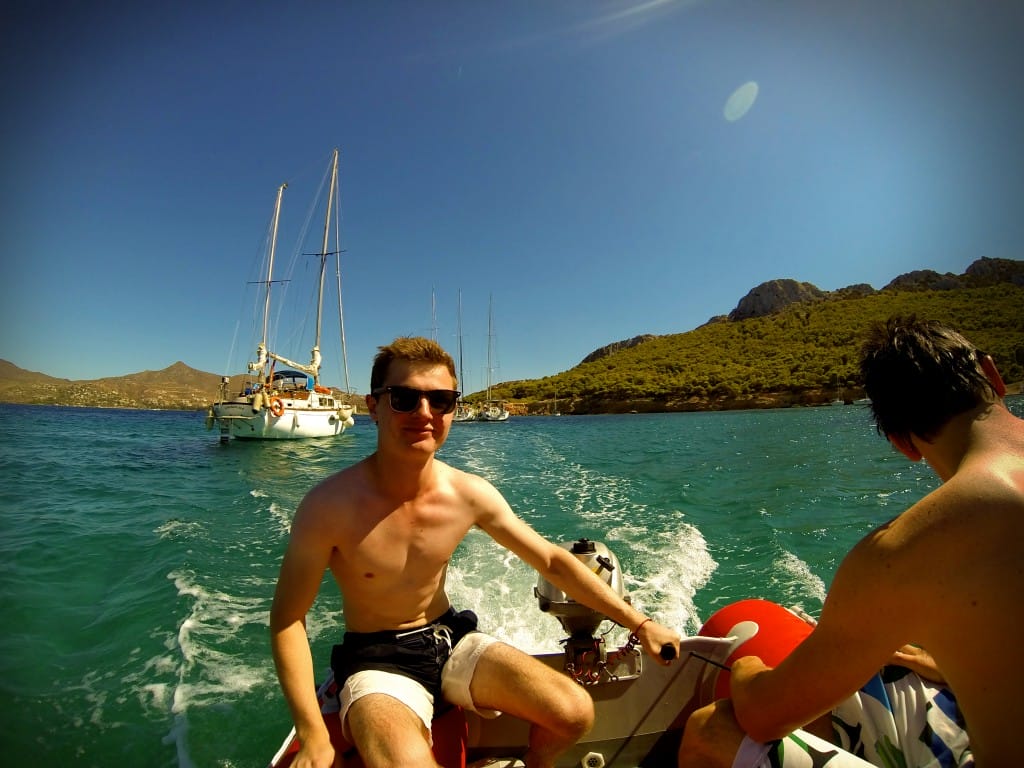 At the helm - in small groups we explored the coastline of the island in dinghies